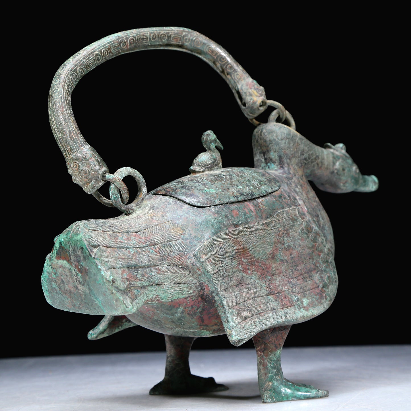 An Archaic Bronze Duck-Form Pot With Inscriptions And An Overhead Handle