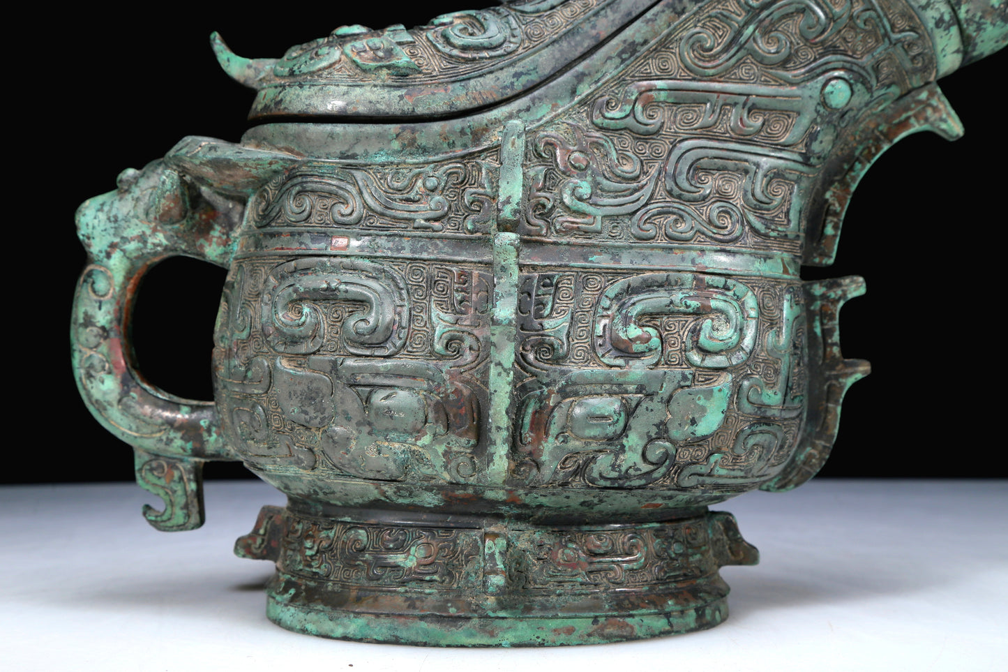 An Archaic Bronze 'Animal Mask' Ewer And Cover With Inscriptions