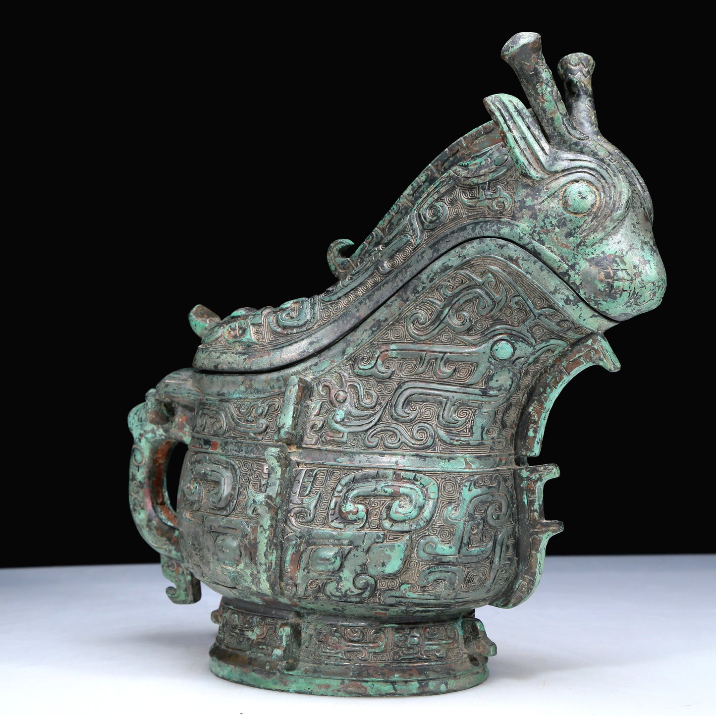 An Archaic Bronze 'Animal Mask' Ewer And Cover With Inscriptions