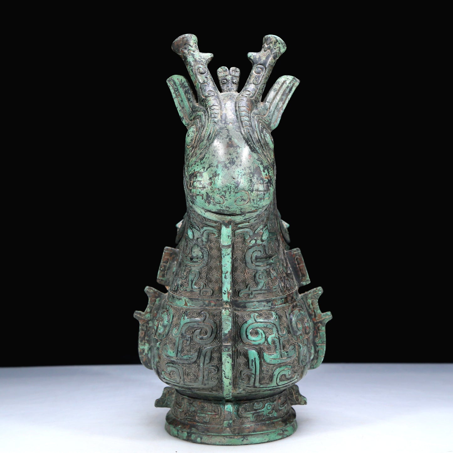 An Archaic Bronze 'Animal Mask' Ewer And Cover With Inscriptions