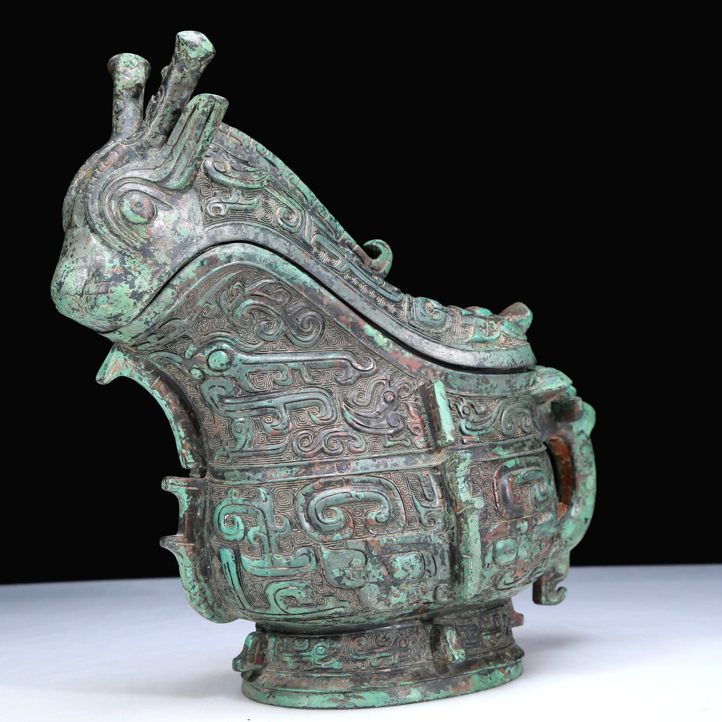 An Archaic Bronze 'Animal Mask' Ewer And Cover With Inscriptions