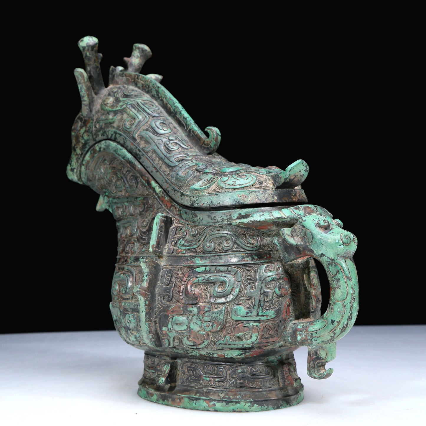An Archaic Bronze 'Animal Mask' Ewer And Cover With Inscriptions