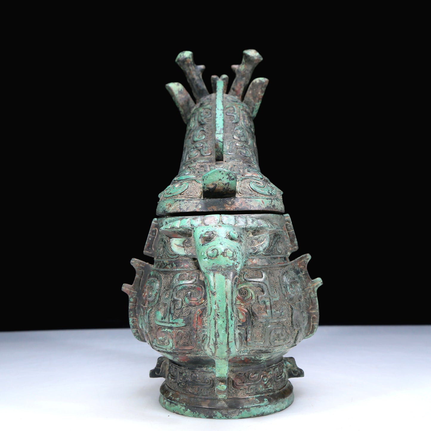 An Archaic Bronze 'Animal Mask' Ewer And Cover With Inscriptions