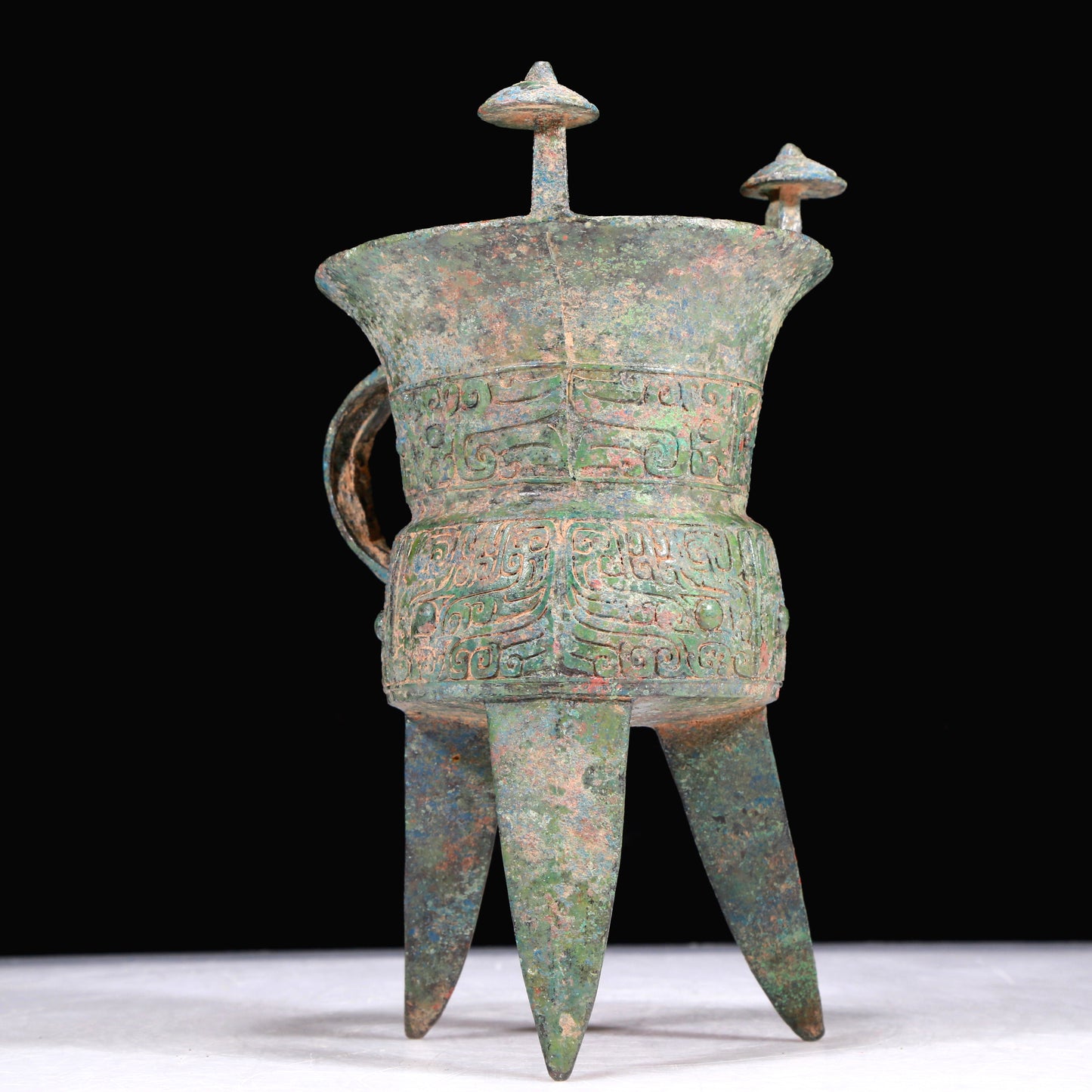 A Superb Bronze 'Animal Mask' Tripod Cup