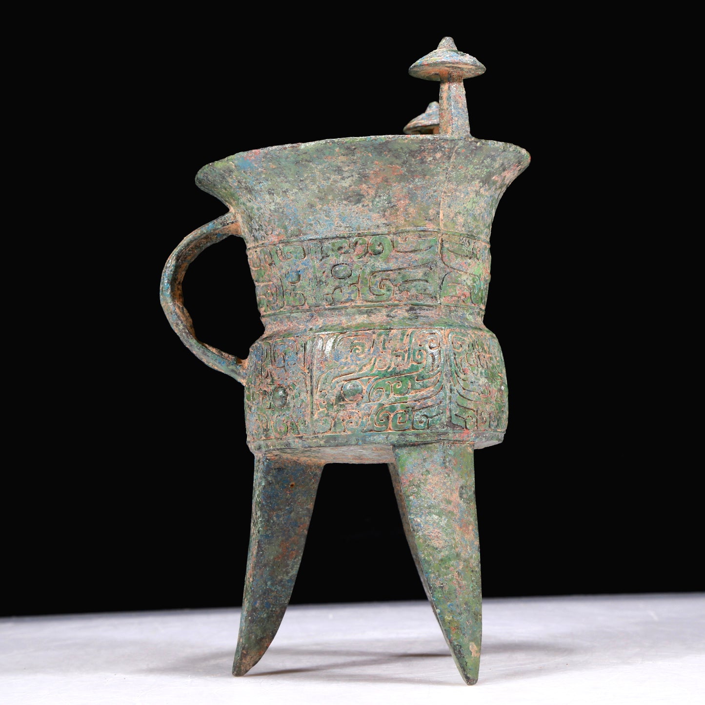 A Superb Bronze 'Animal Mask' Tripod Cup