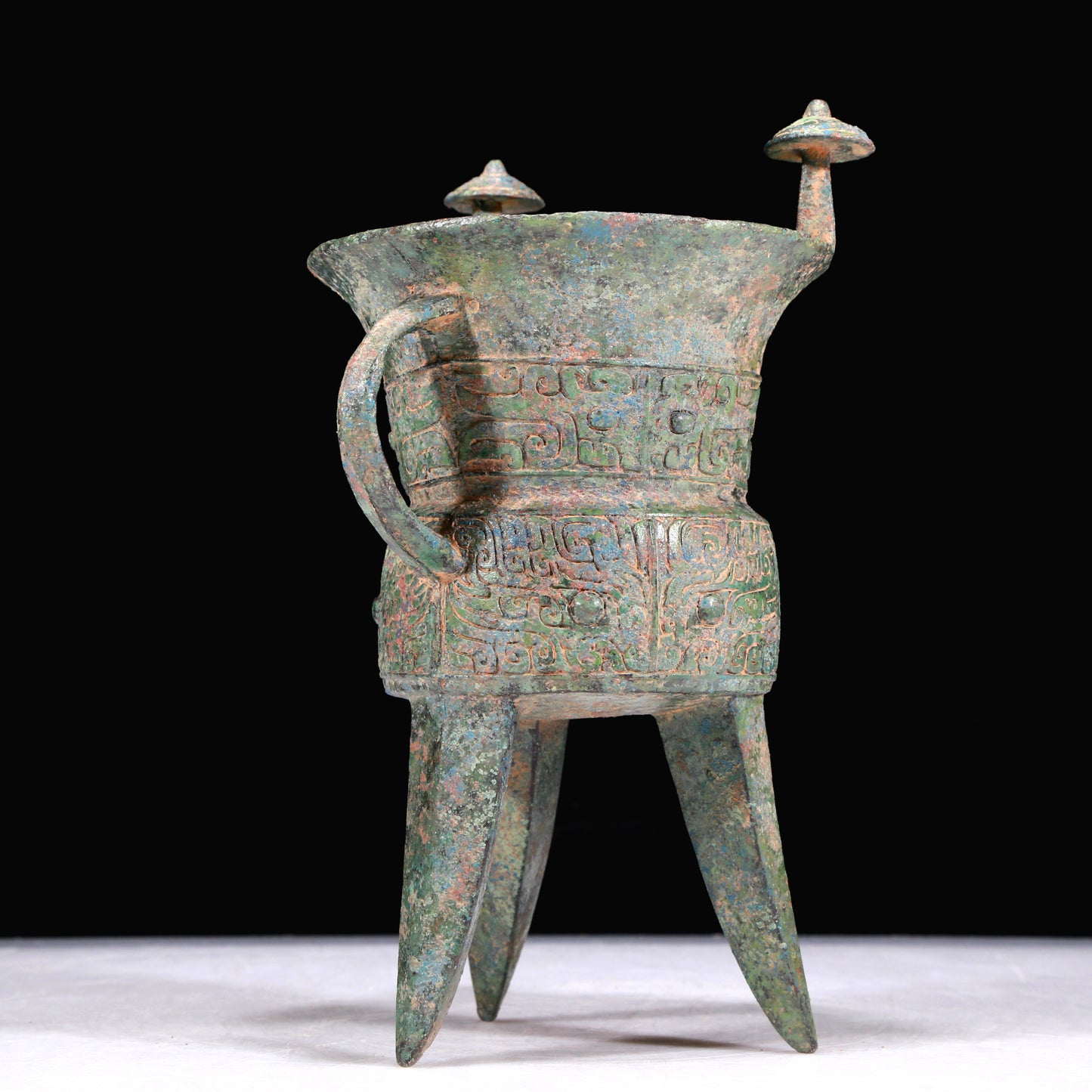 A Superb Bronze 'Animal Mask' Tripod Cup