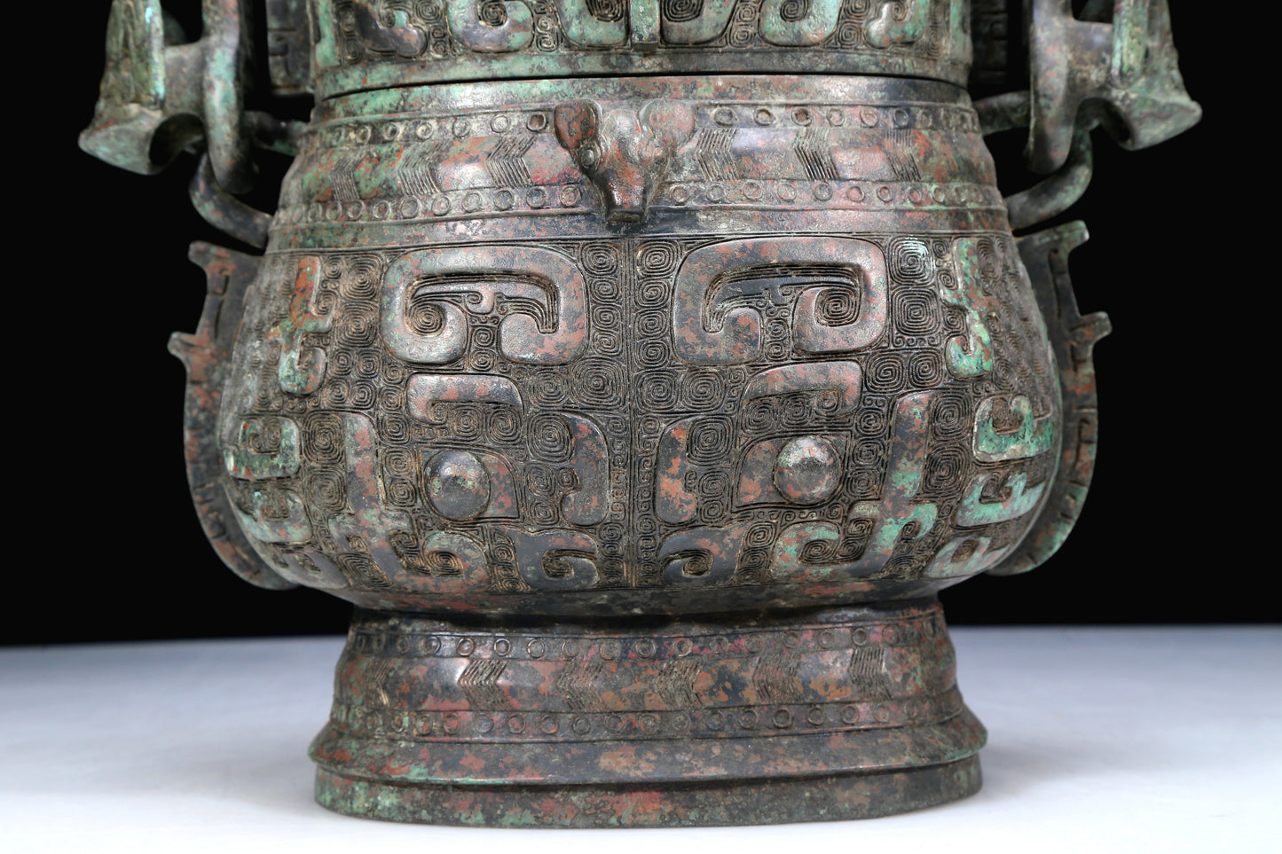 An Archaic Bronze 'Animal Mask' Pot With Inscriptions And An Overhead Handle