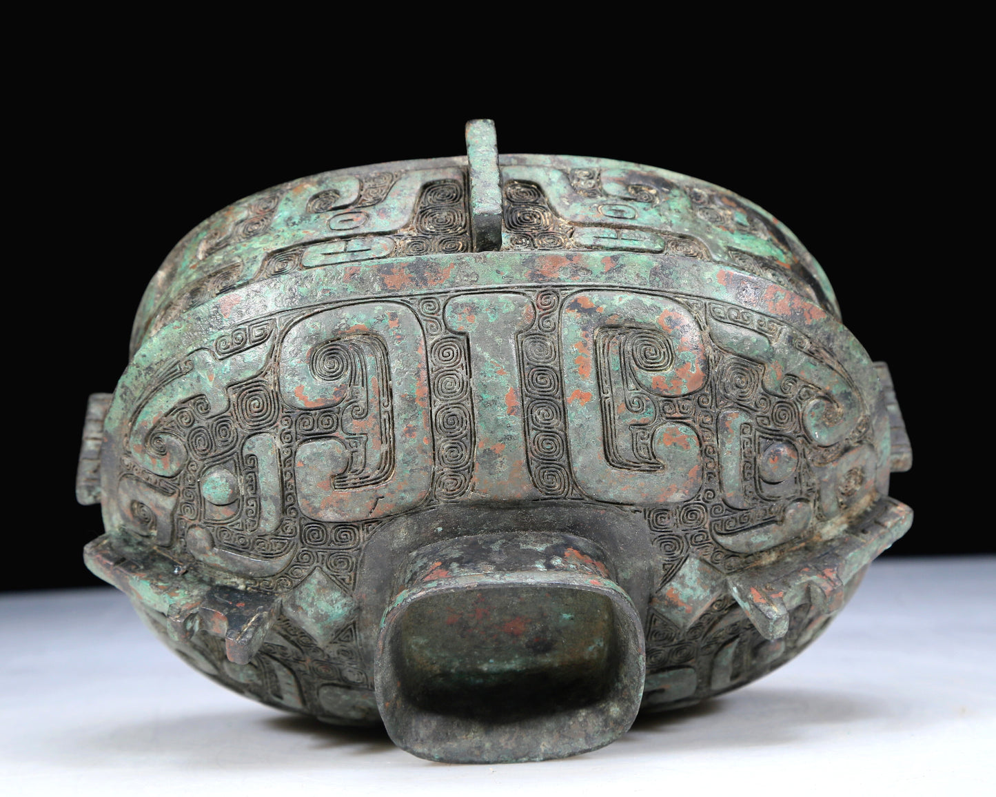 An Archaic Bronze 'Animal Mask' Pot With Inscriptions And An Overhead Handle