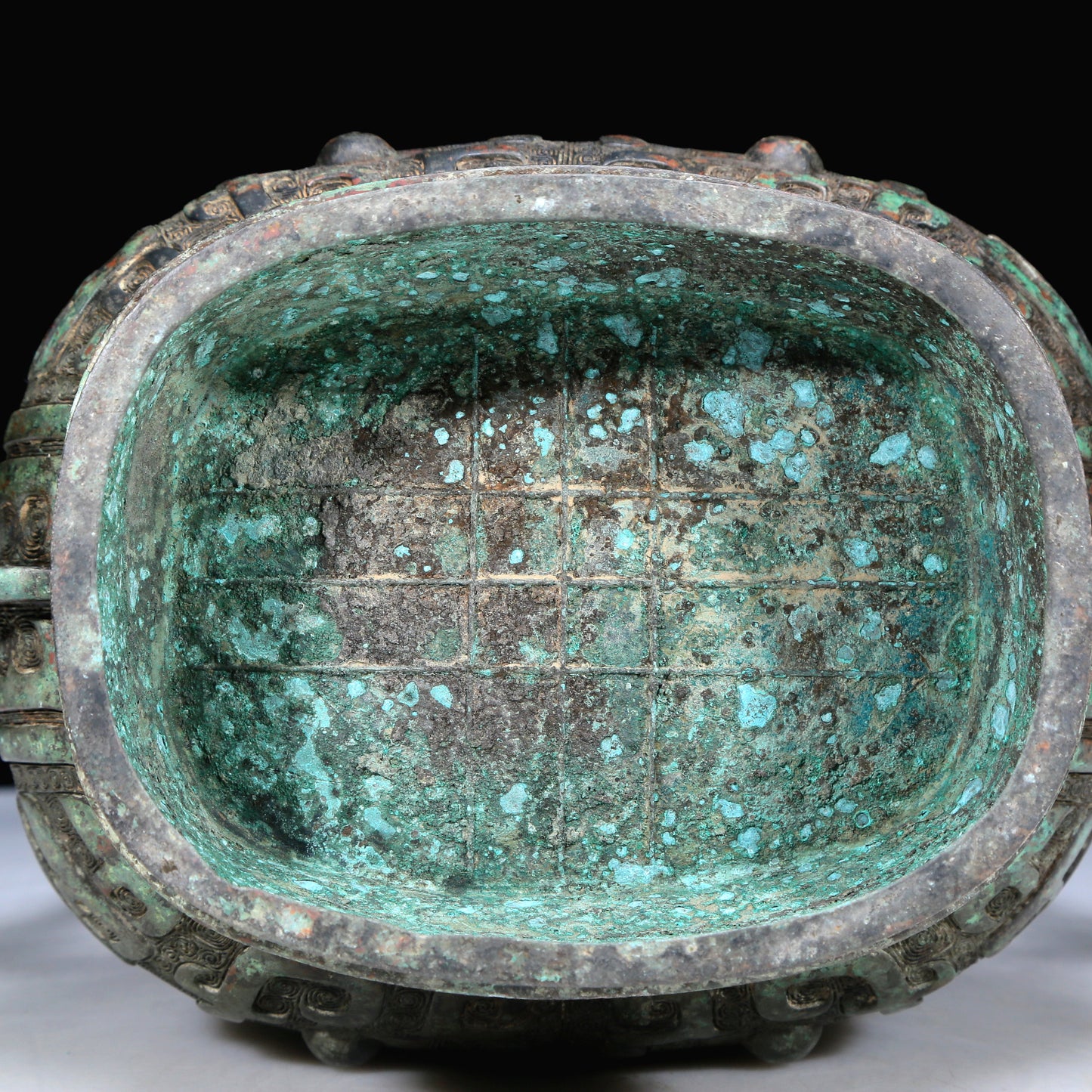 An Archaic Bronze 'Animal Mask' Pot With Inscriptions And An Overhead Handle