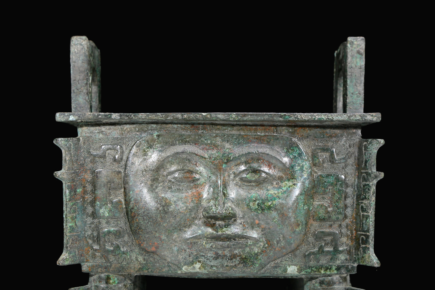 An Archaic Bronze 'Human Mask' Ritual Food Vessel, Ding