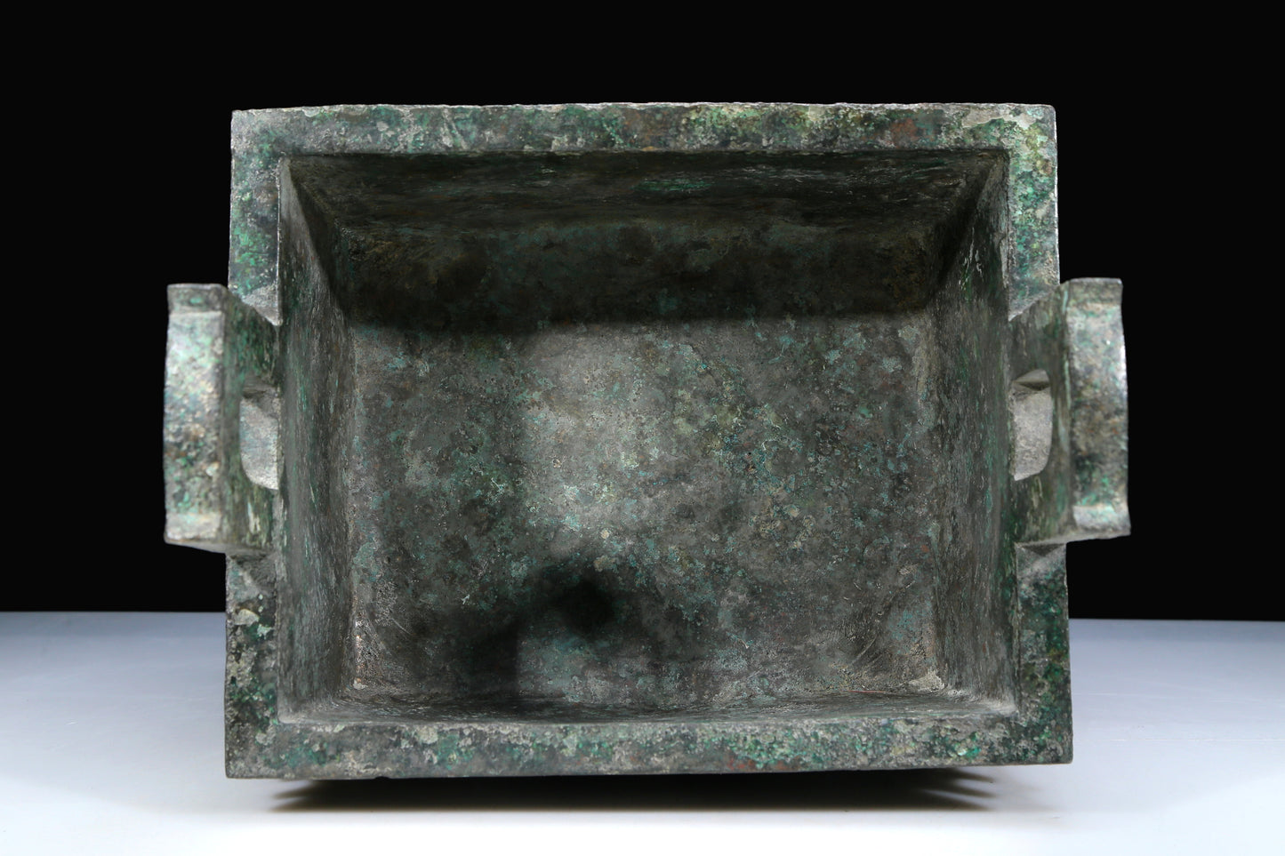 An Archaic Bronze 'Human Mask' Ritual Food Vessel, Ding