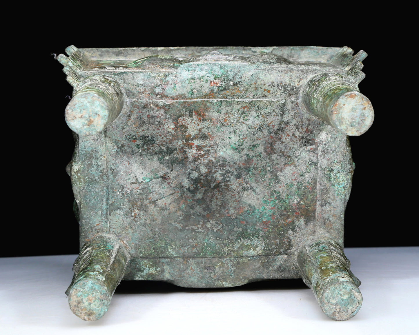 An Archaic Bronze 'Human Mask' Ritual Food Vessel, Ding