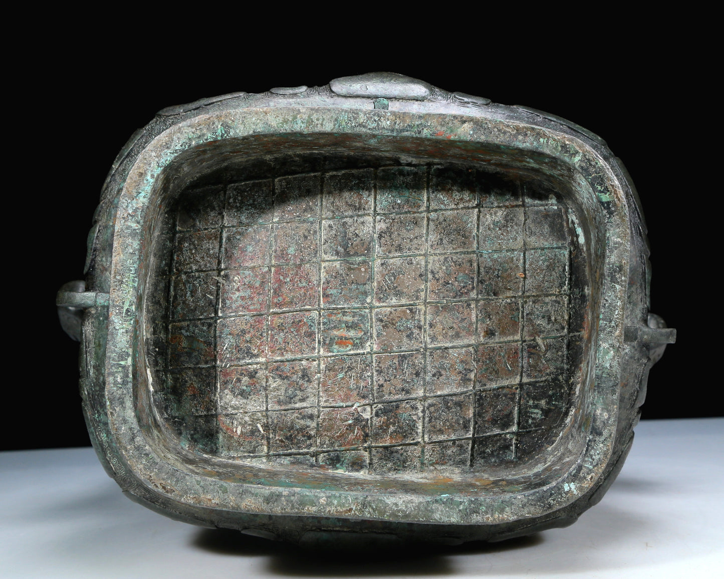 An Archaic Bronze 'Animal Mask' Pot With Inscriptions And An Overhead Handle
