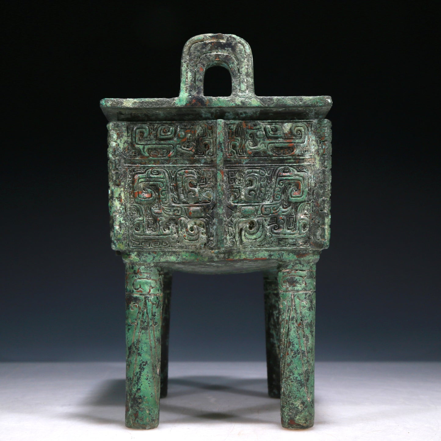 A Wonderful Bronze 'Animal Mask' Ritual Food Vessel, Ding, With Inscriptions
