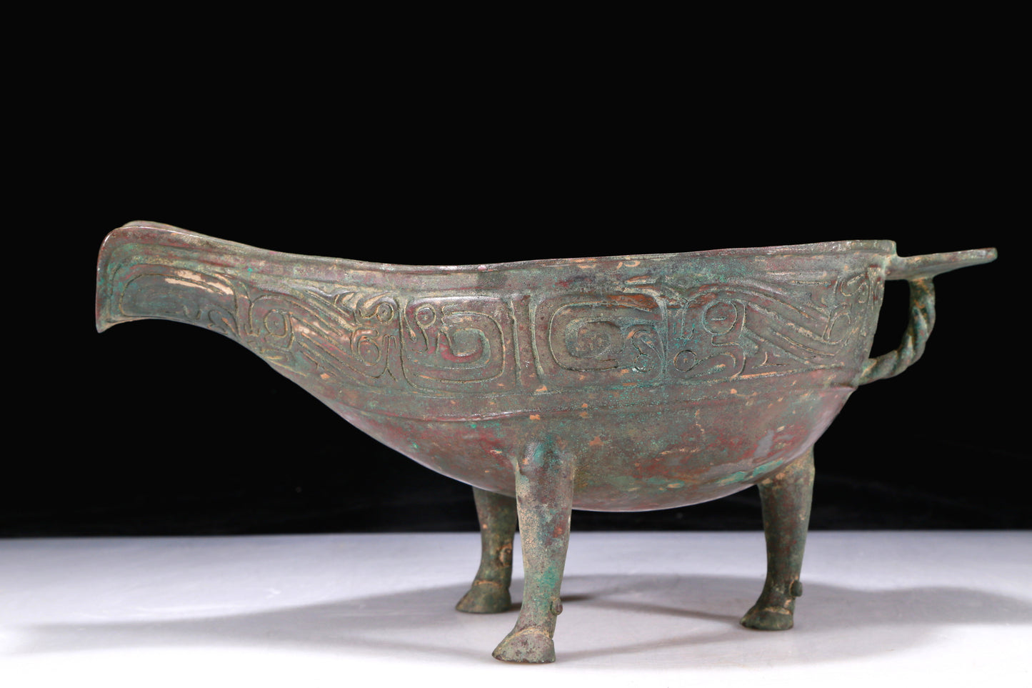 An Excellent Bronze 'Auspicious Beast' Tripod Ewer