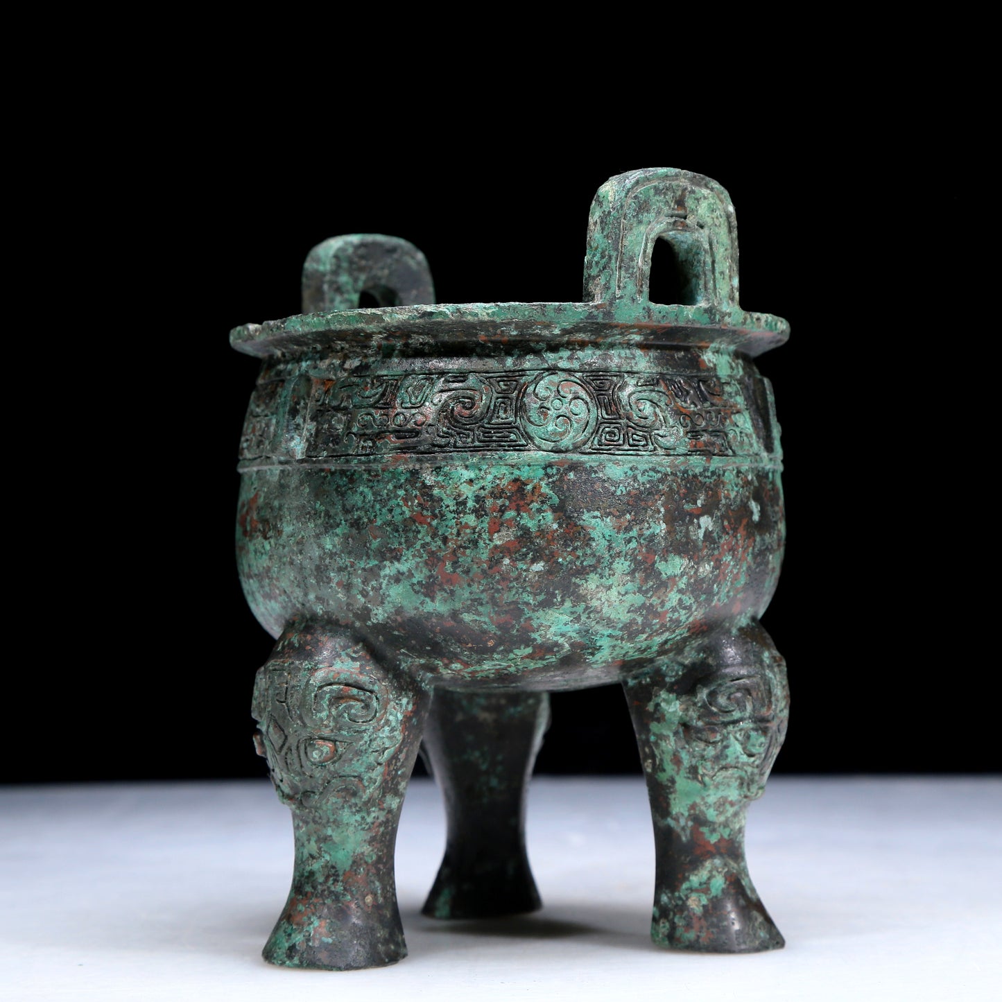 An Archaic Bronze 'Auspicious Beast' Tripod Censer