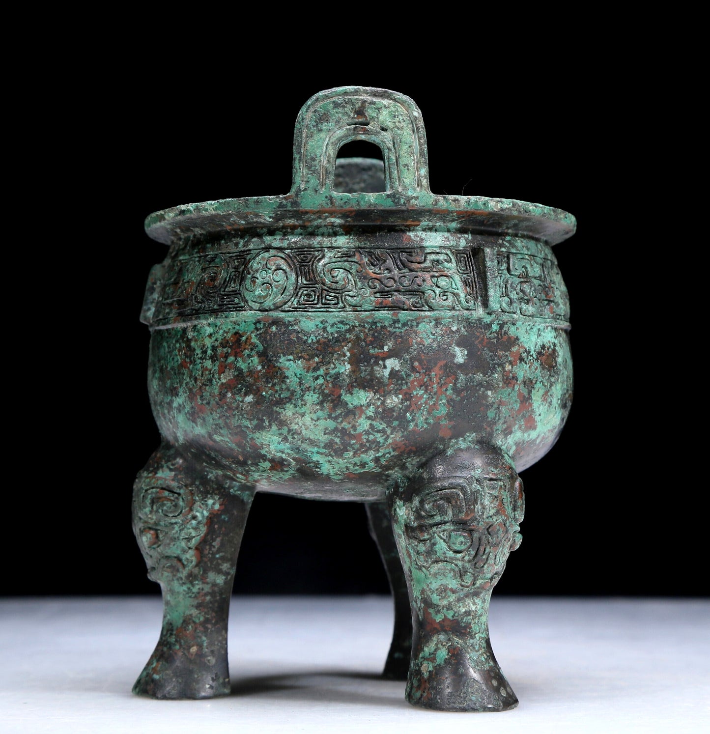 An Archaic Bronze 'Auspicious Beast' Tripod Censer