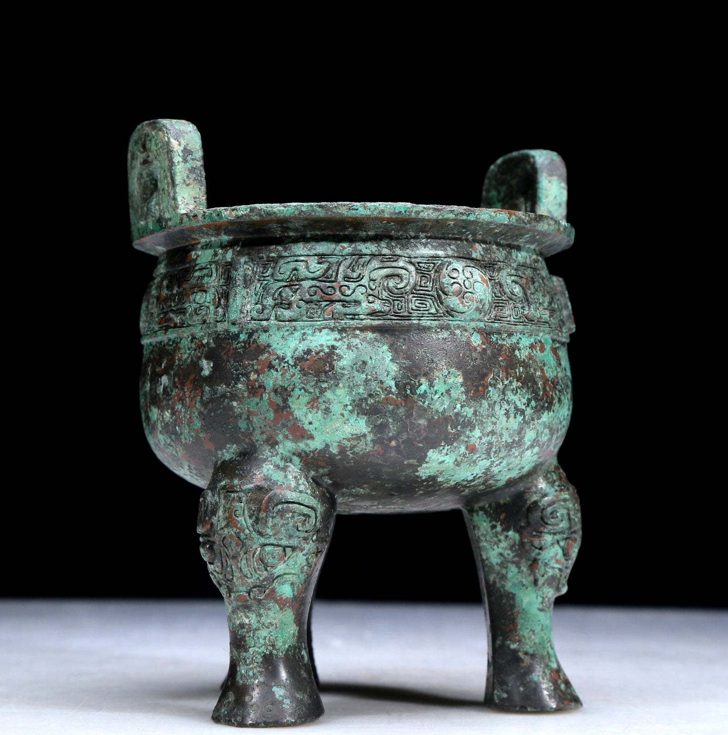 An Archaic Bronze 'Auspicious Beast' Tripod Censer