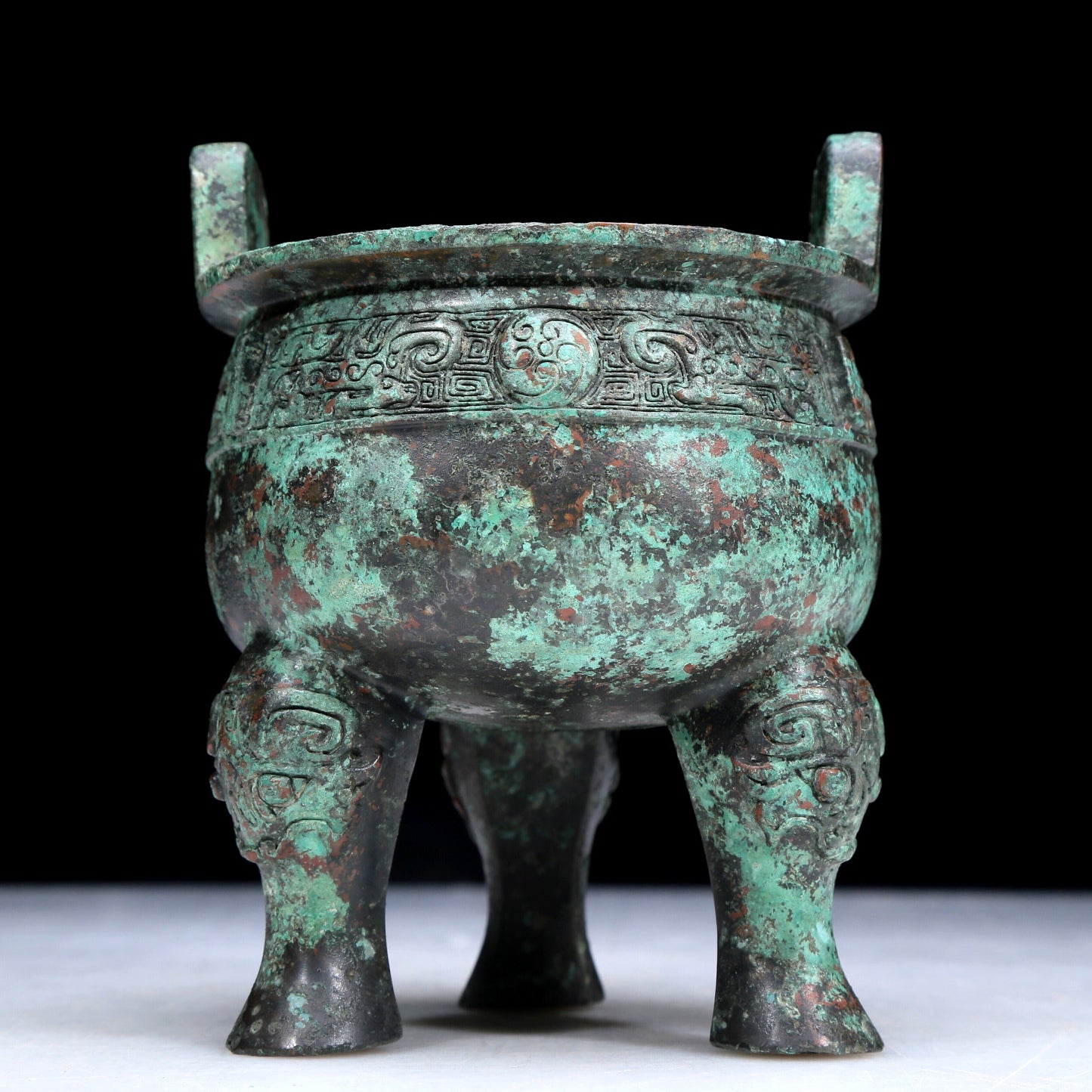 An Archaic Bronze 'Auspicious Beast' Tripod Censer