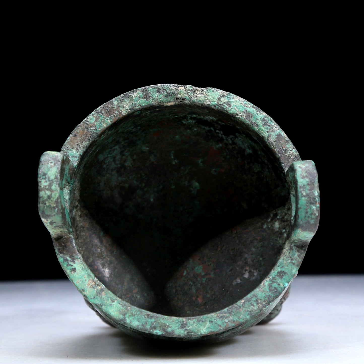 An Archaic Bronze 'Auspicious Beast' Tripod Censer
