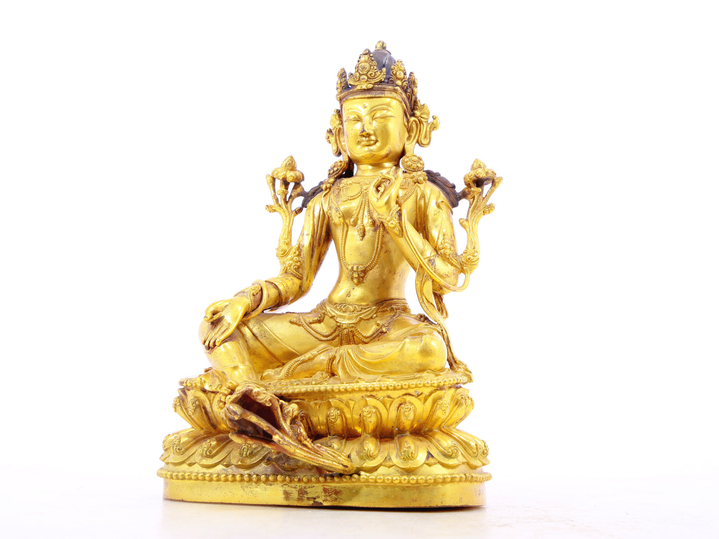 A solemn gilt bronze statue of Tara