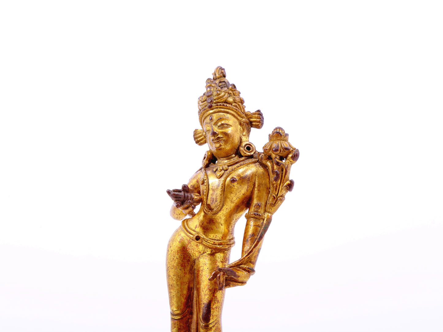 A serene gilt bronze statue of Tara
