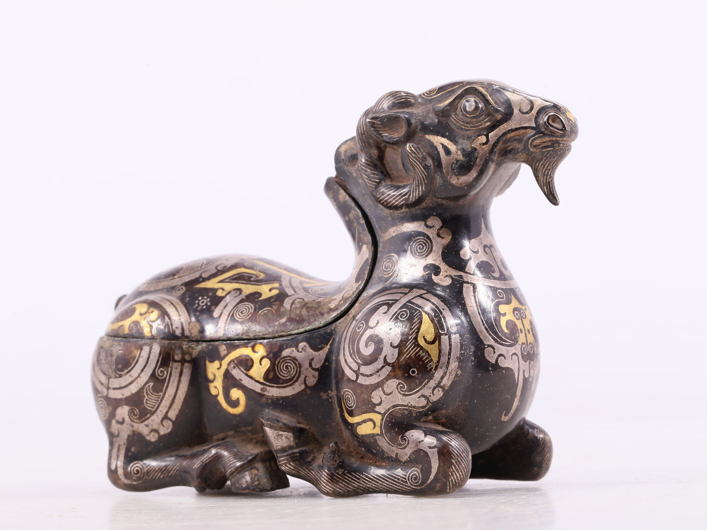 An Excellent Bronze Gold& Silver-Mounted Ram-Form Candlestick