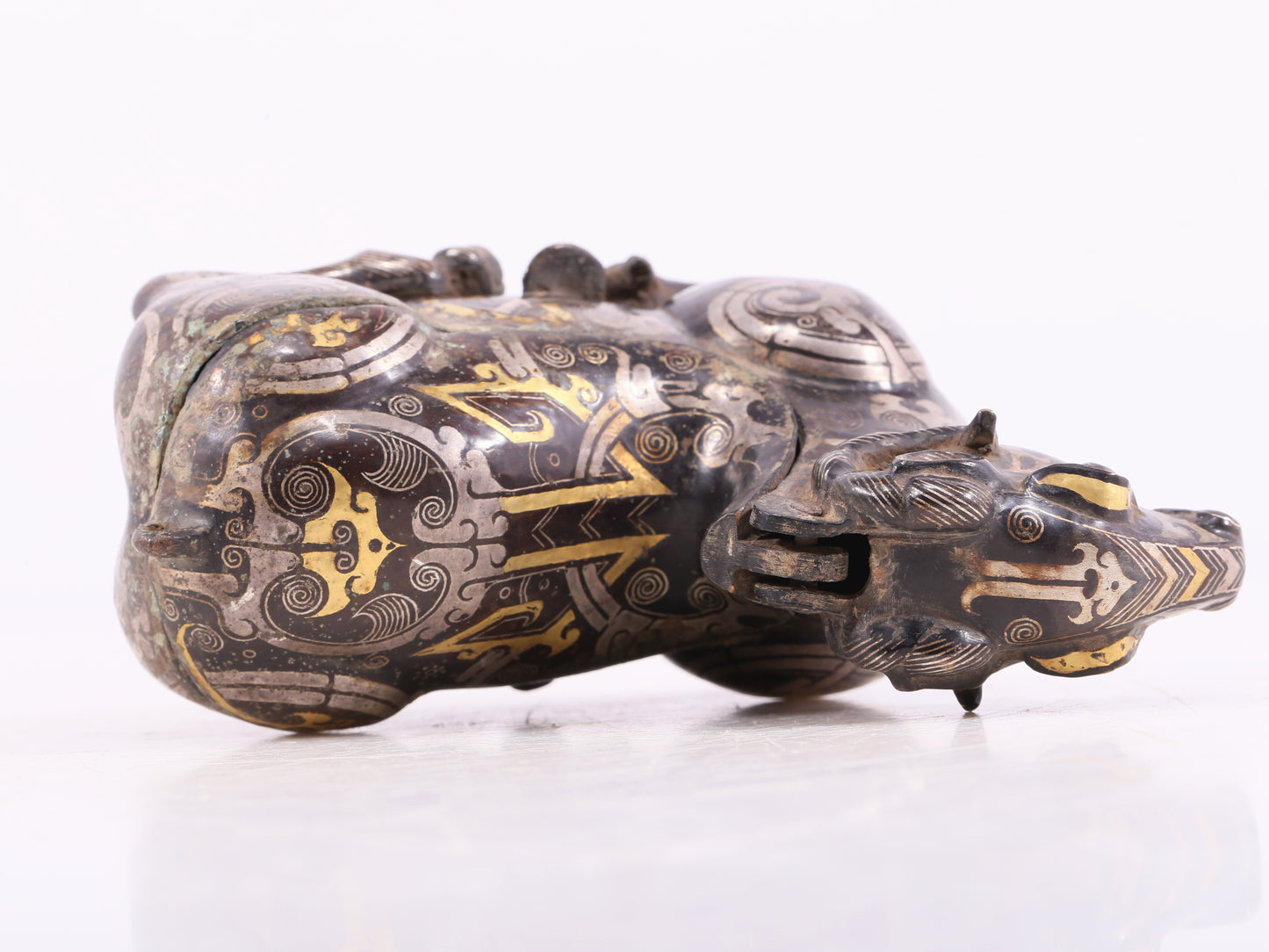 An Excellent Bronze Gold& Silver-Mounted Ram-Form Candlestick
