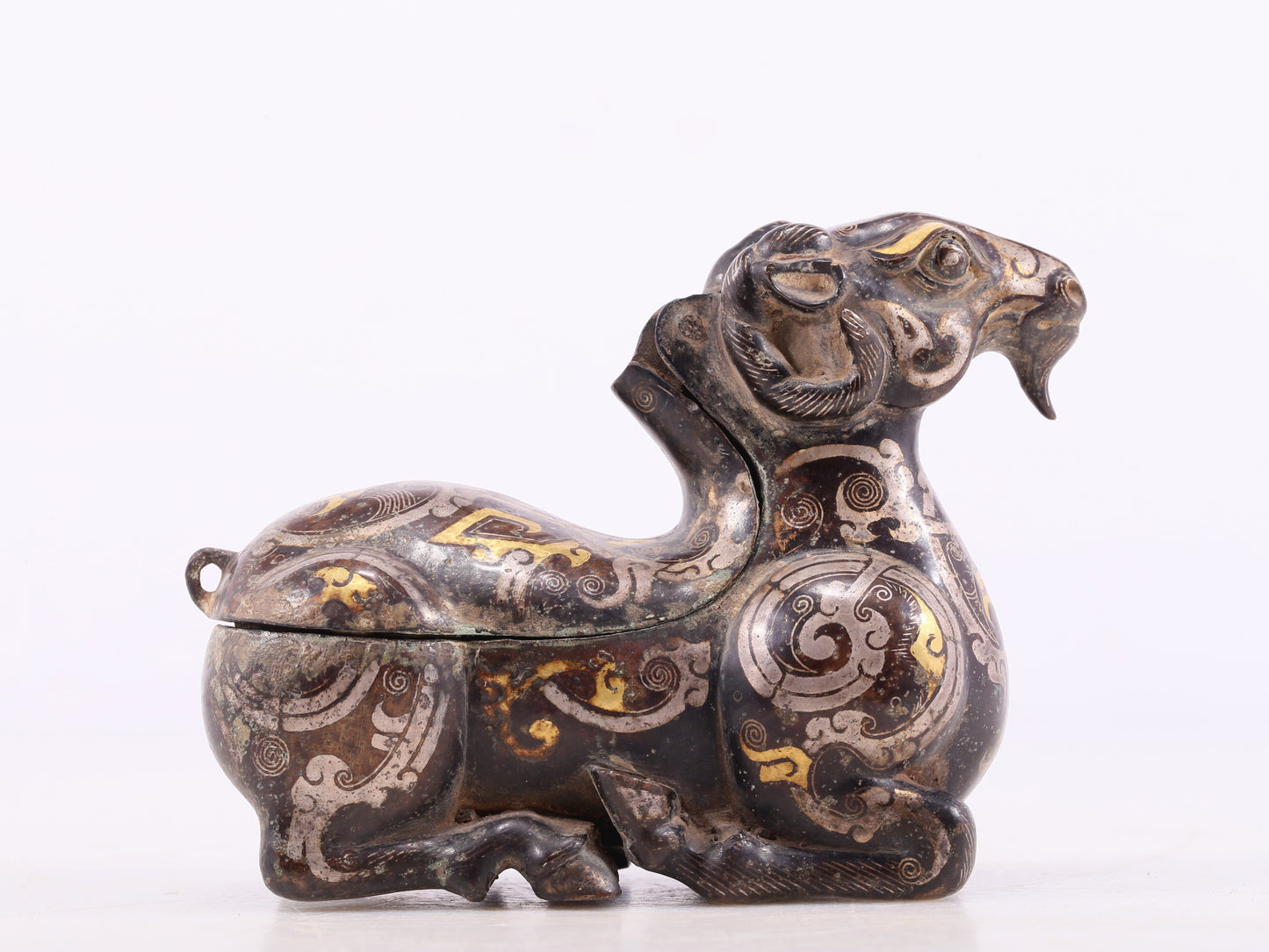 An Archaic Bronze Gold& Silver-Mounted Ram-Form Candlestick