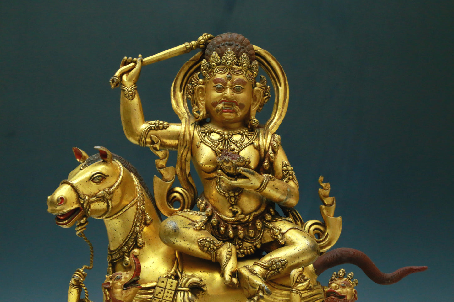 A Wonderful Gilt-Bronze Figure Of Kubera Seated On A Horse