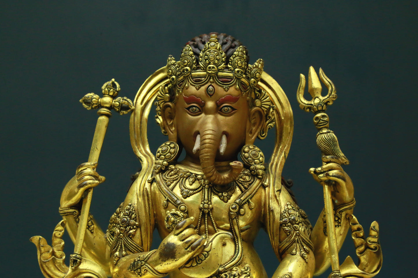 A Wonderful Gilt-Bronze Figure Of Kubera With An Elephant's Trunk