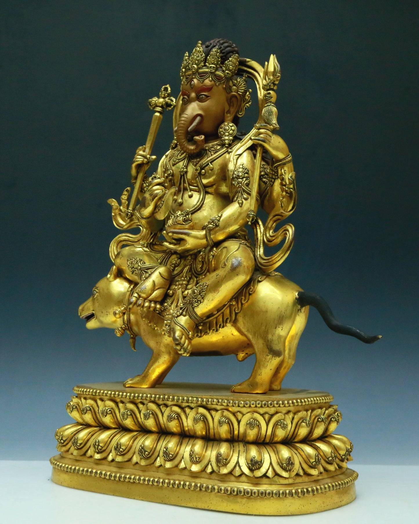 A Wonderful Gilt-Bronze Figure Of Kubera With An Elephant's Trunk