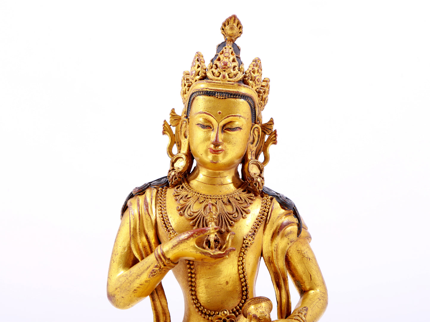 A solemn gilt bronze statue of Vajrasattva