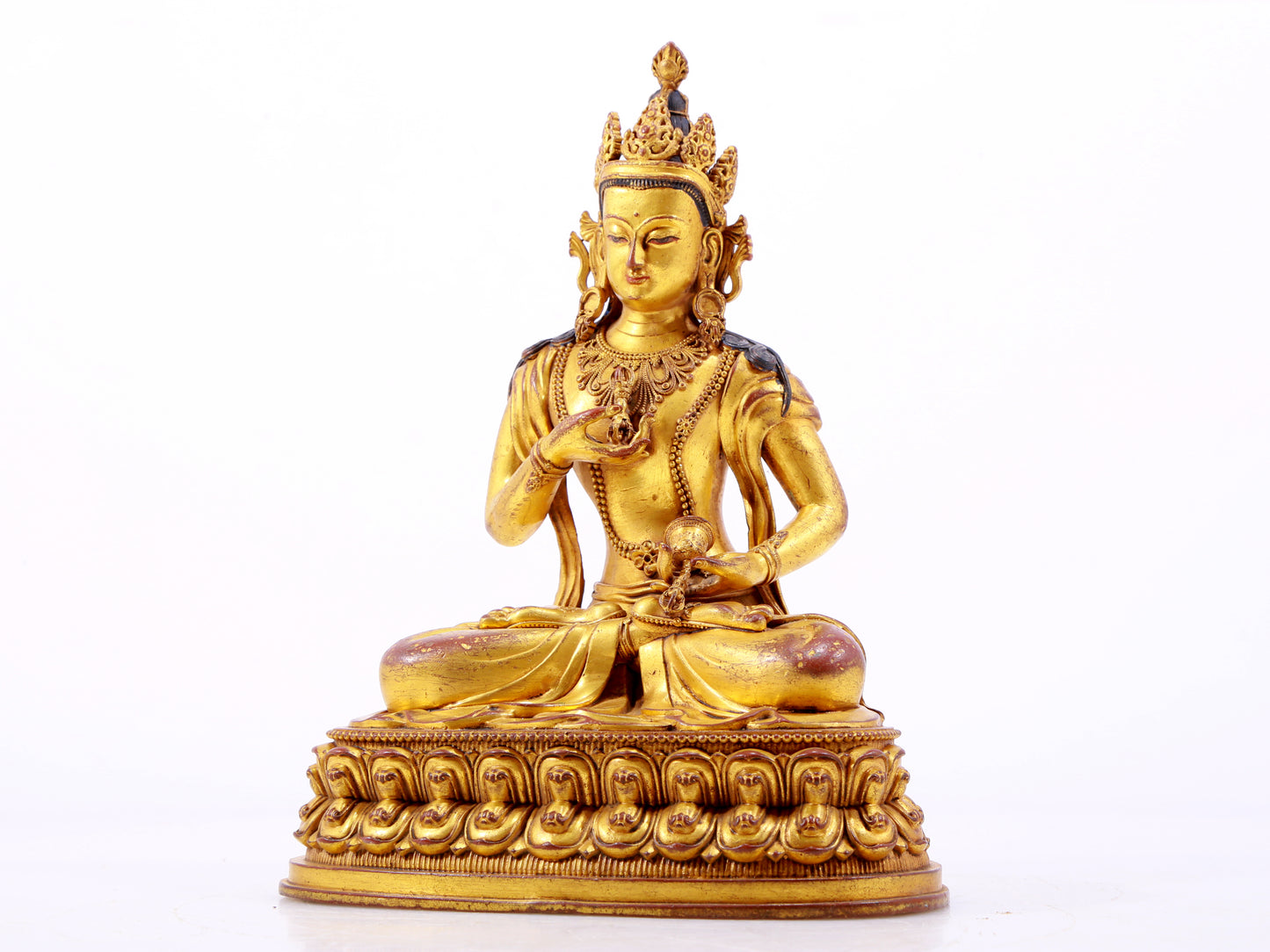 A solemn gilt bronze statue of Vajrasattva
