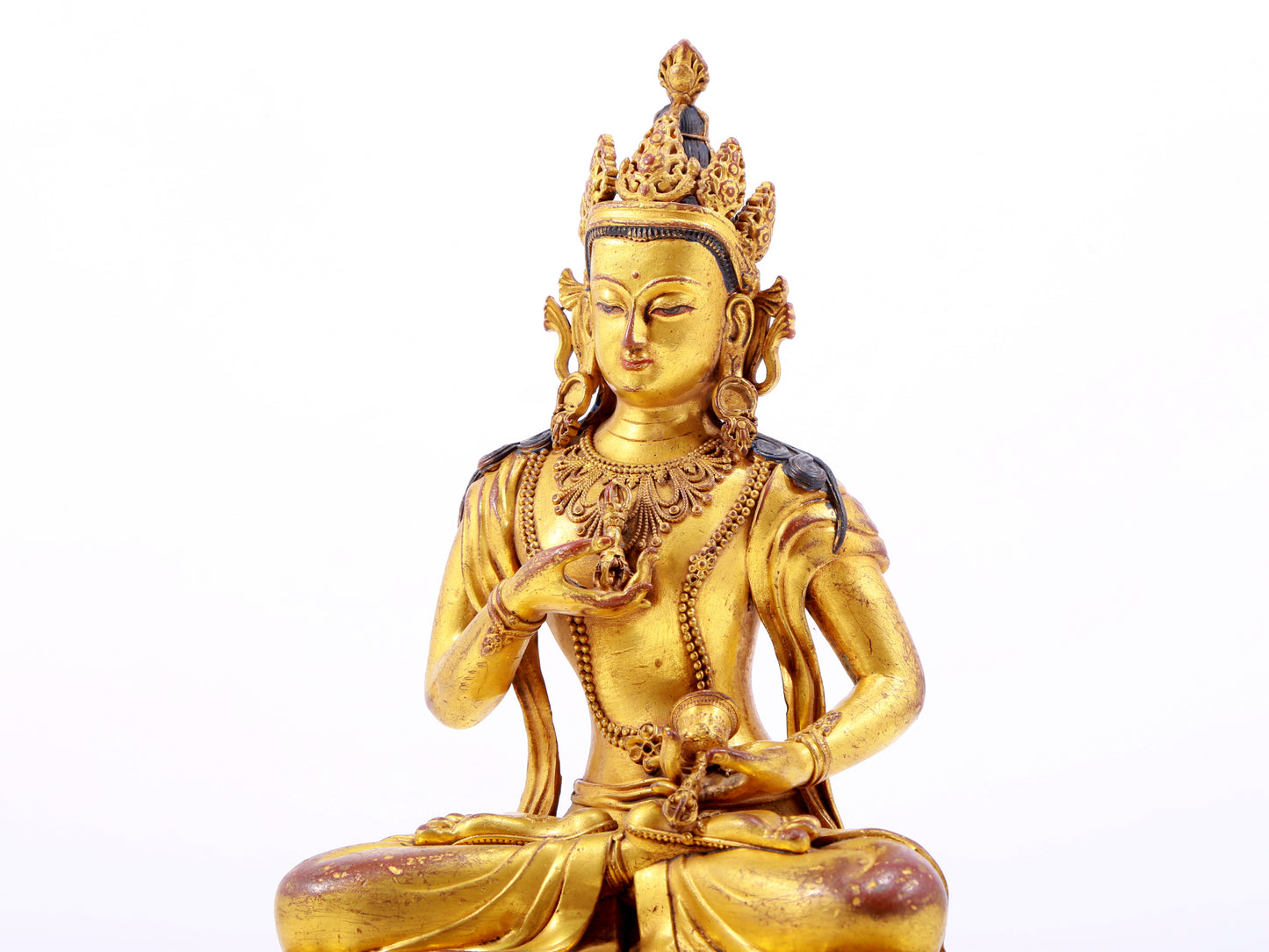 A solemn gilt bronze statue of Vajrasattva