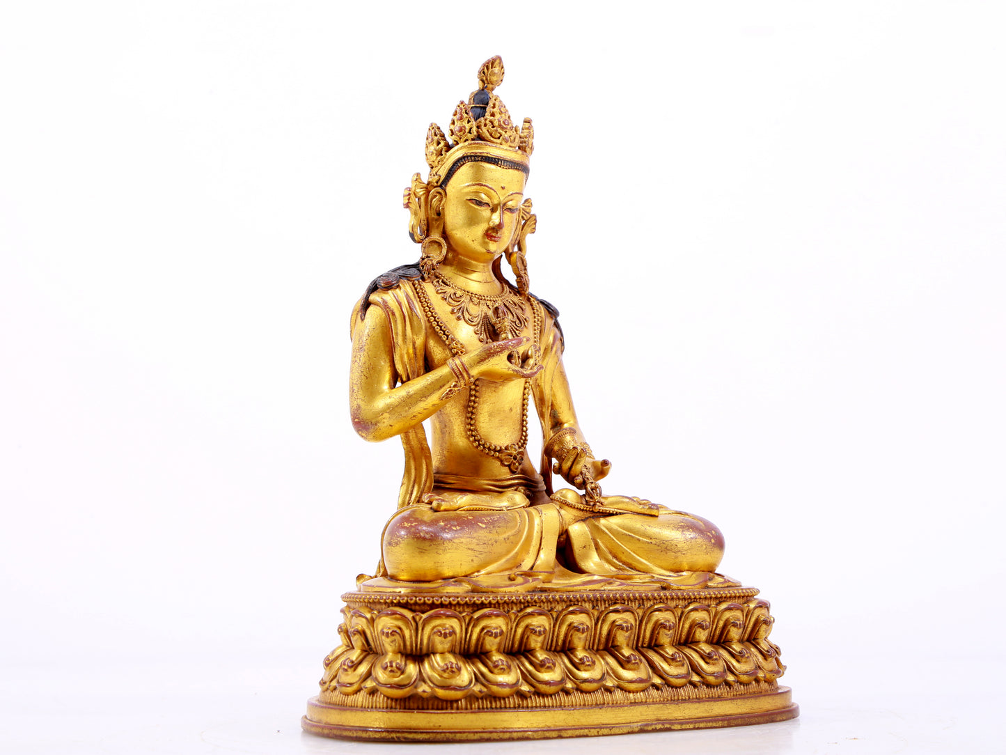 A solemn gilt bronze statue of Vajrasattva