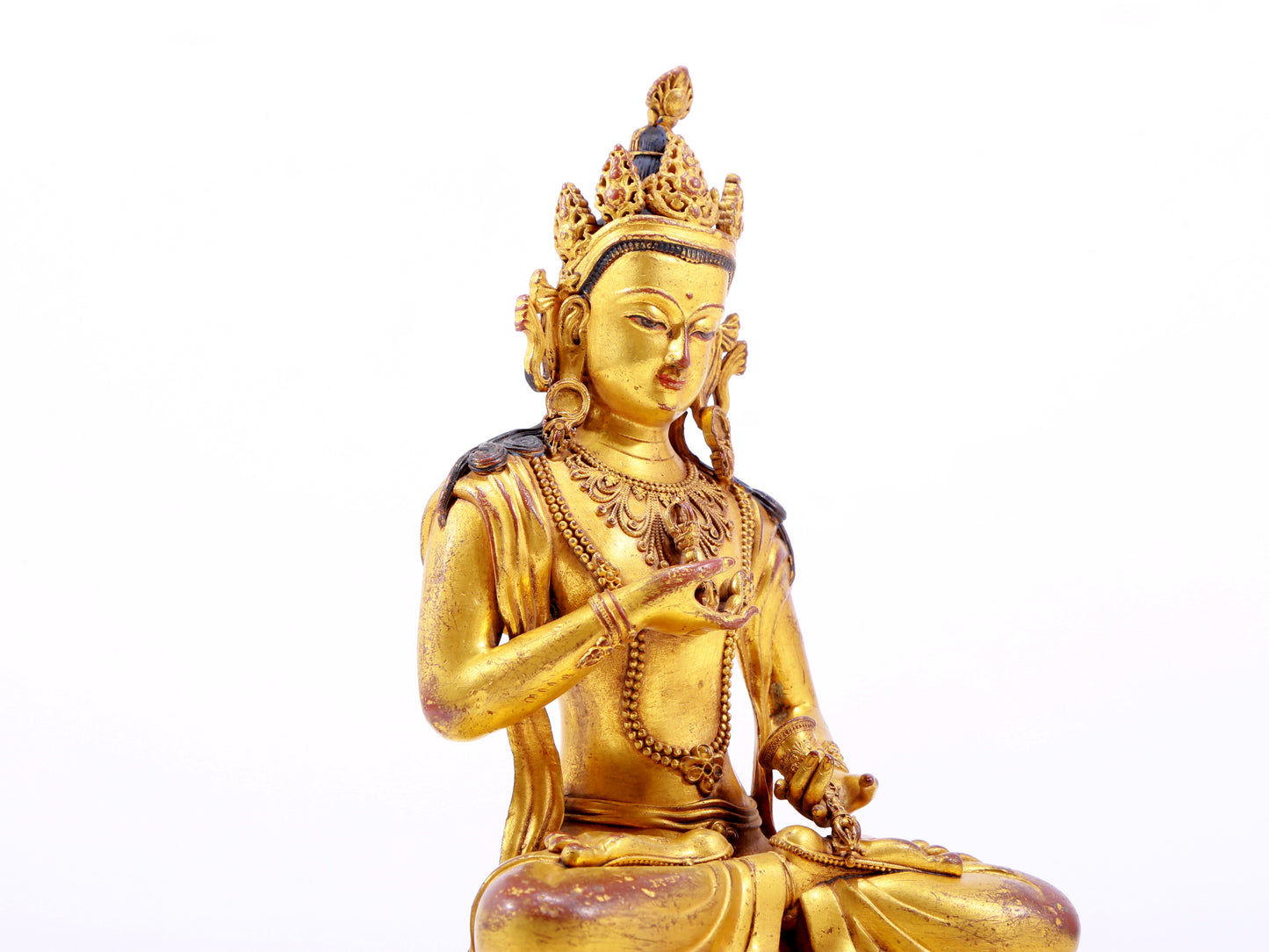 A solemn gilt bronze statue of Vajrasattva