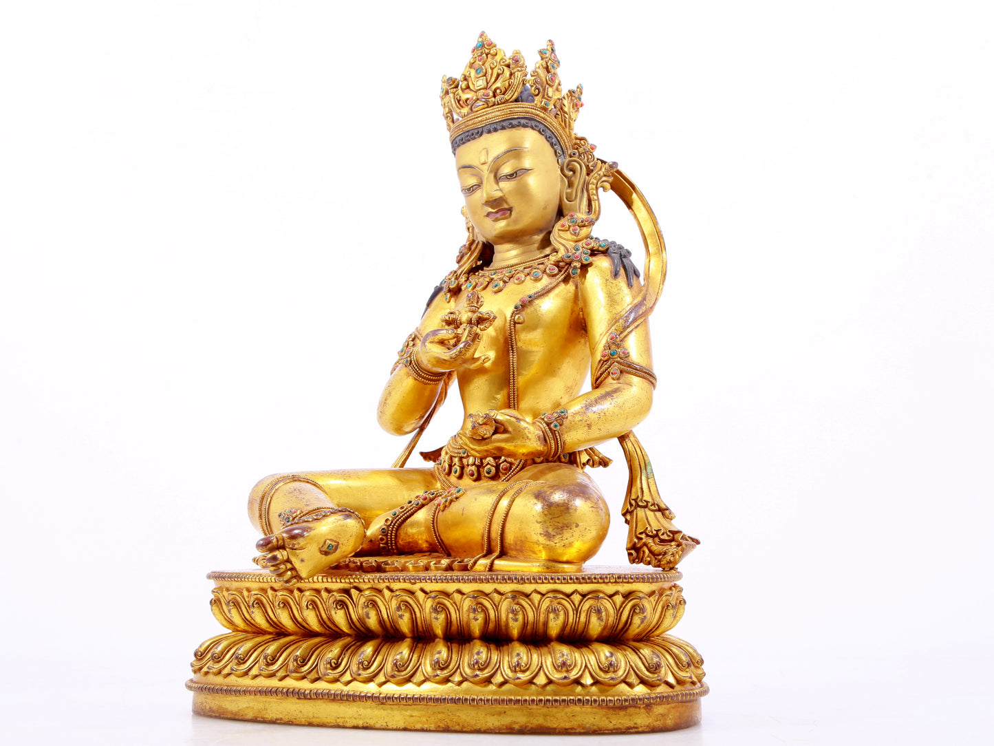 A solemn gilt bronze statue of Vajrasattva inlaid with hundreds of treasures