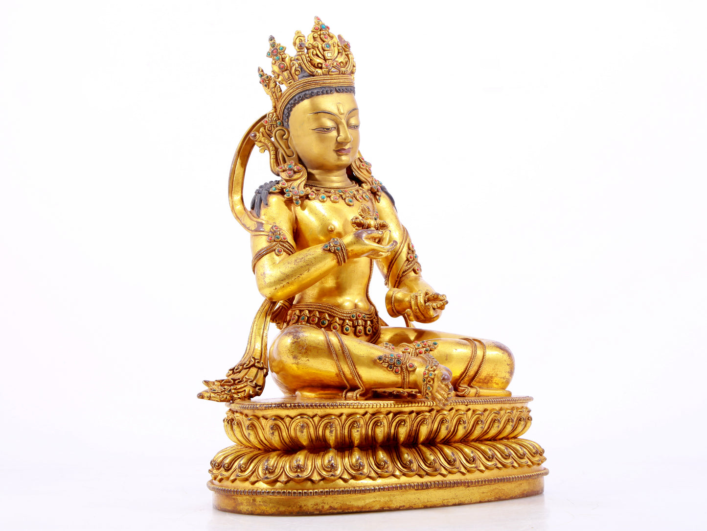 A solemn gilt bronze statue of Vajrasattva inlaid with hundreds of treasures