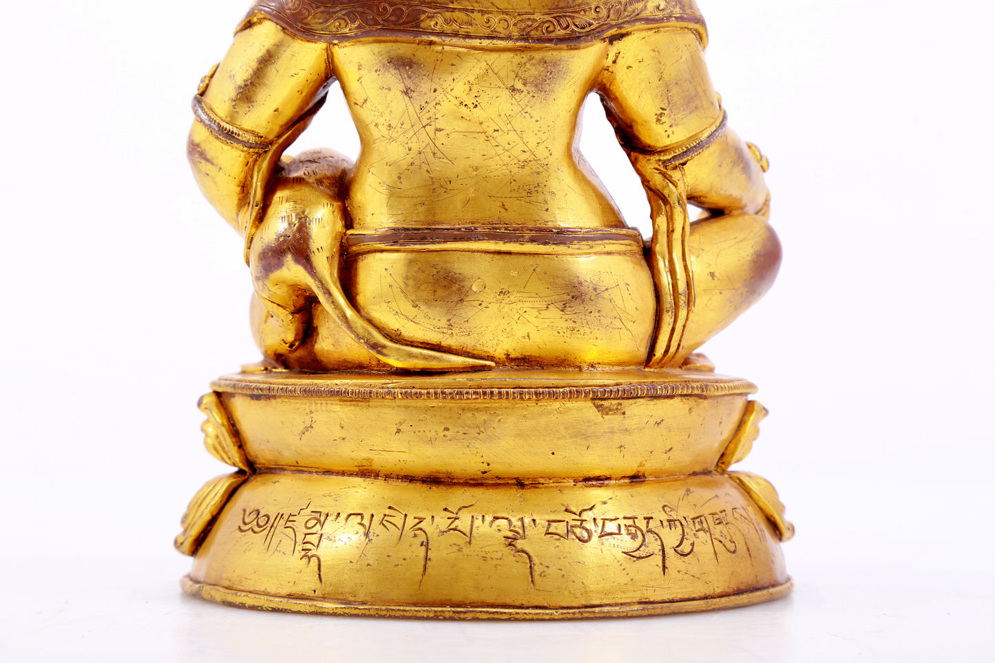 A stately gilt bronze statue of the God of Wealth with inscription