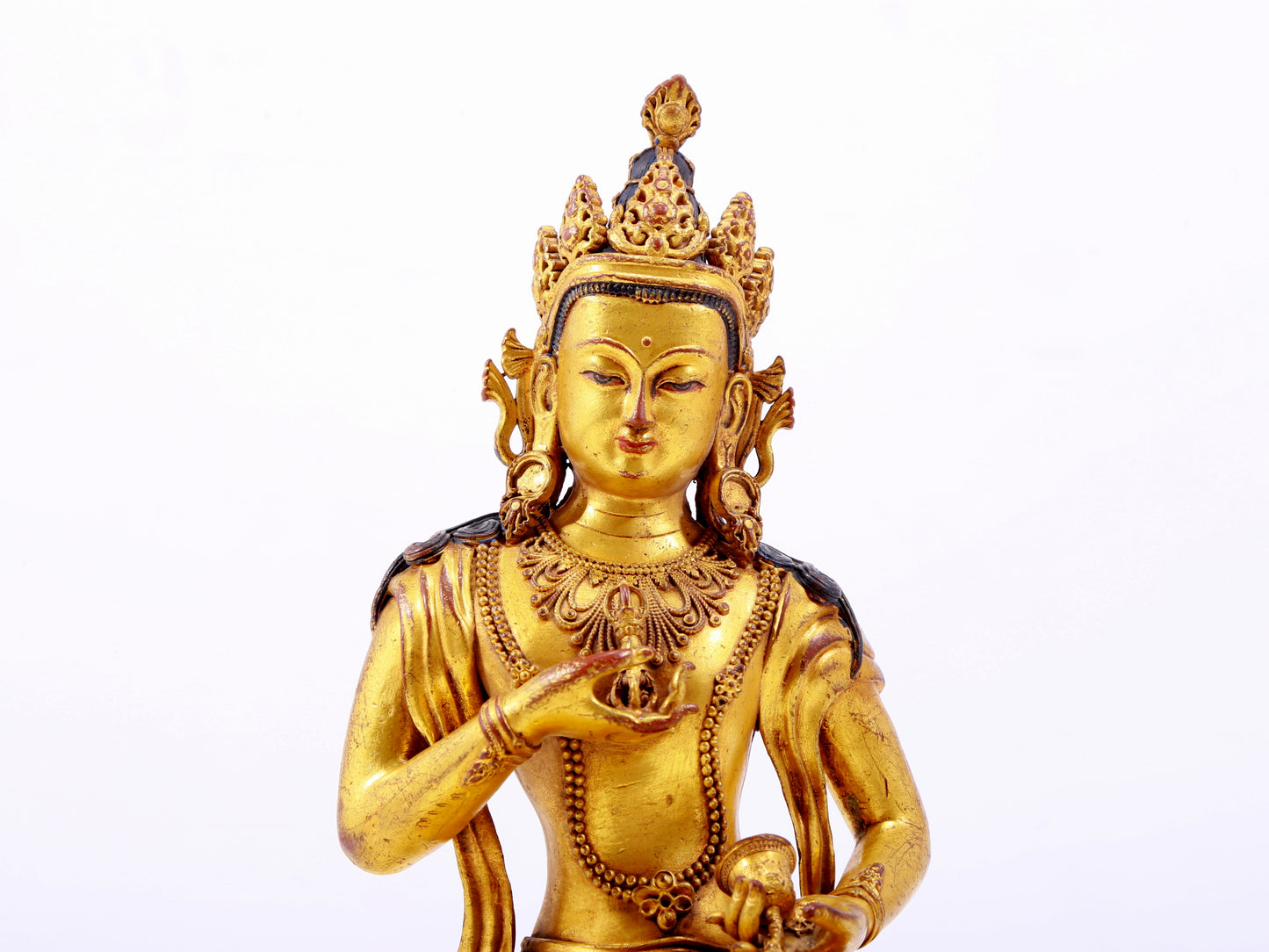 A solemn gilt bronze statue of Vajrasattva