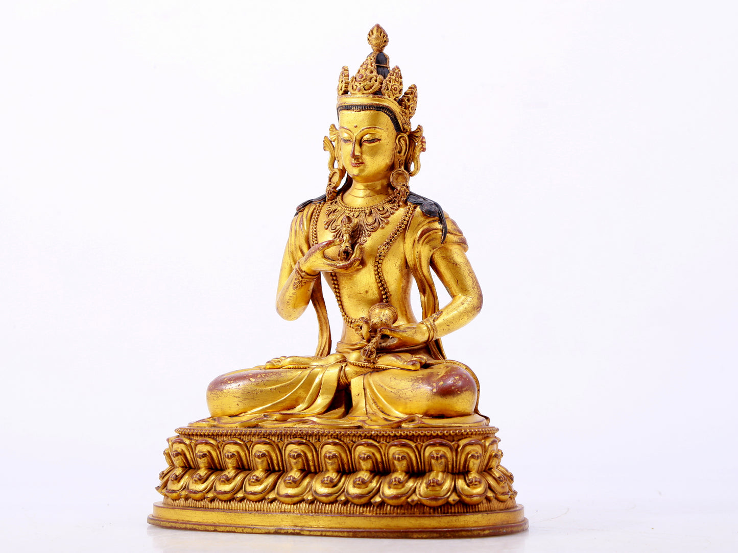 A solemn gilt bronze statue of Vajrasattva