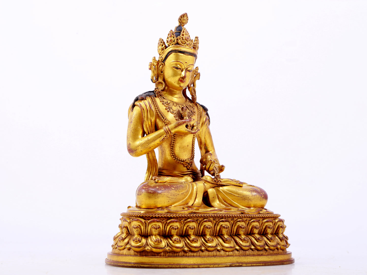 A solemn gilt bronze statue of Vajrasattva