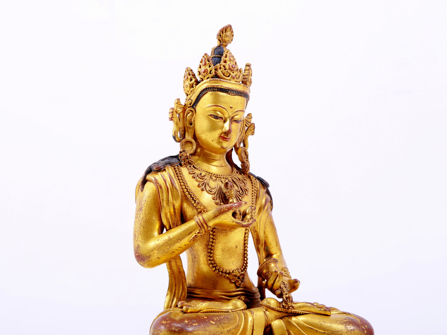 A solemn gilt bronze statue of Vajrasattva