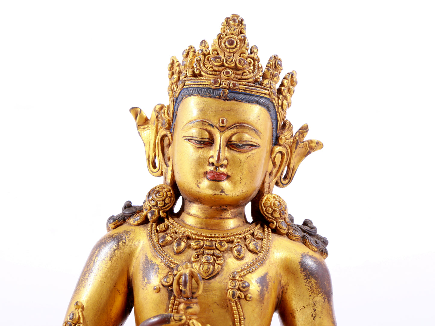 A solemn gilt bronze statue of Vajrasattva
