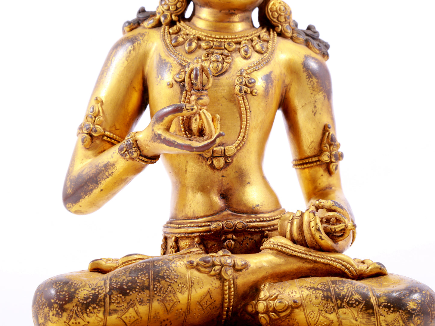 A solemn gilt bronze statue of Vajrasattva