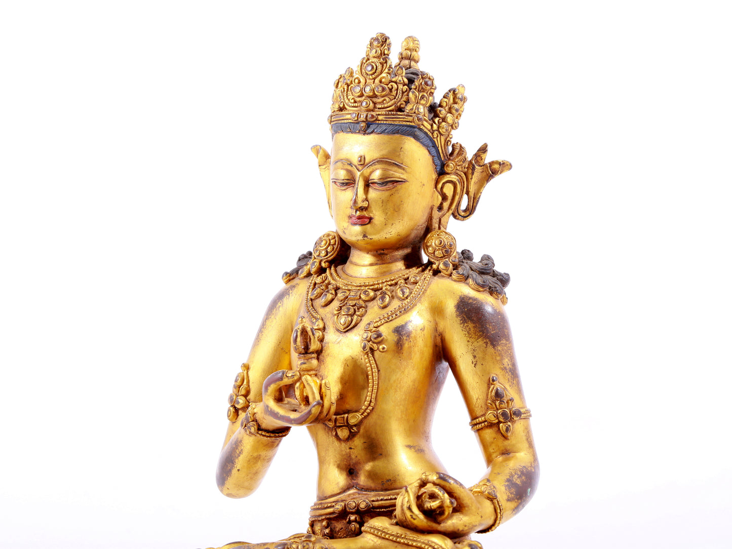 A solemn gilt bronze statue of Vajrasattva