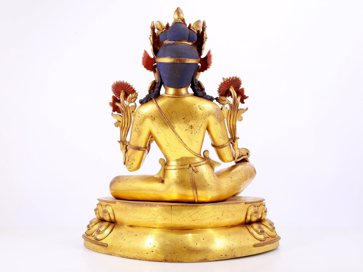 A solemn gilt copper inlaid turquoise green Tara statue