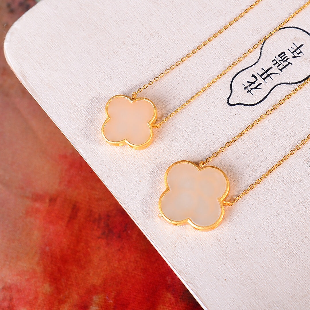 Gilt silver inlaid Hetian jade four-leaf clover pendant