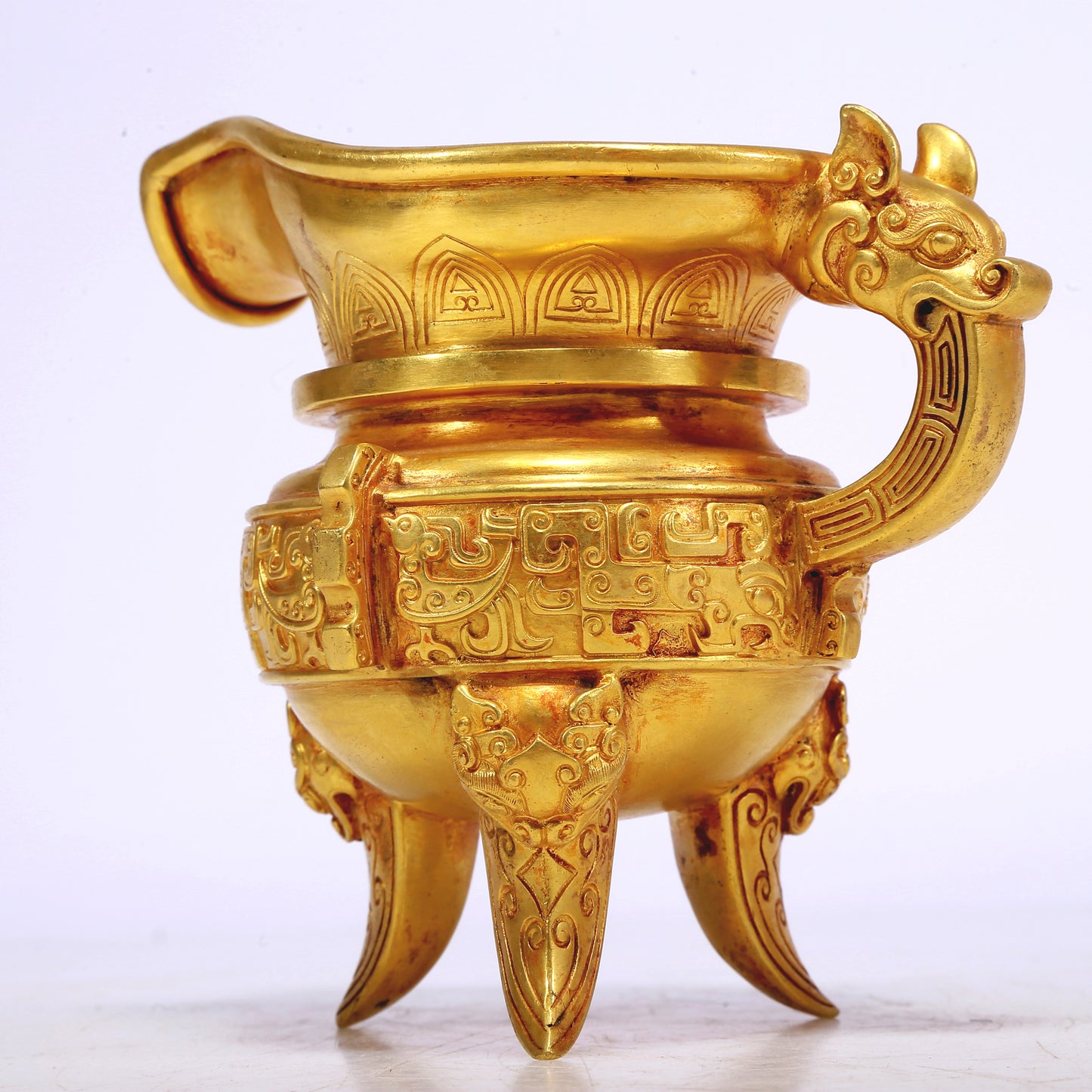 A Fantastic Gilt-Bronze 'Auspicious Beast' Tripod Ewer